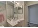 Charming bathroom featuring a white vanity, bright lighting, and a glimpse into the shower area at 222 Draw Bridge Ln, Valrico, FL 33594