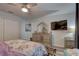 Cozy bedroom with ceiling fan, mirrored dresser, and modern decor; perfect for relaxation at 222 Draw Bridge Ln, Valrico, FL 33594