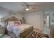 Comfortable bedroom featuring a ceiling fan, closet, and stylish zebra print rug on wood floor at 222 Draw Bridge Ln, Valrico, FL 33594