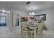 Bright dining area with marble floors, stylish bar area, and lovely chandelier at 222 Draw Bridge Ln, Valrico, FL 33594