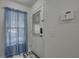 Clean, well-lit entryway with a storm door and view of a window with blinds at 222 Draw Bridge Ln, Valrico, FL 33594