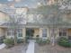 Inviting townhome with stone accents and covered porch, showcasing a well-kept exterior at 222 Draw Bridge Ln, Valrico, FL 33594