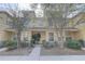 Inviting townhome with stone accents and covered porch, showcasing a well-kept exterior at 222 Draw Bridge Ln, Valrico, FL 33594
