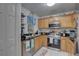 Updated kitchen featuring modern appliances, granite counters, and ample cabinetry at 222 Draw Bridge Ln, Valrico, FL 33594