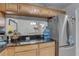 Stylish kitchen bar offers a view to the dining area and staircase at 222 Draw Bridge Ln, Valrico, FL 33594