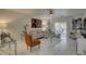 Open concept living room features white marble floors, a stylish sofa, and sliding glass doors at 222 Draw Bridge Ln, Valrico, FL 33594
