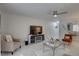 Open living room offers white marble floors, a stylish tv stand, and modern decorations at 222 Draw Bridge Ln, Valrico, FL 33594