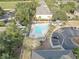 Aerial view of the community pool surrounded by lush landscaping, offering a refreshing retreat for residents at 222 Draw Bridge Ln, Valrico, FL 33594