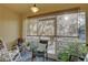 Relaxing screened porch with comfortable seating, plants, and serene views, perfect for enjoying the outdoors in comfort at 222 Draw Bridge Ln, Valrico, FL 33594