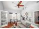 Bright living room with vaulted ceilings, hardwood floors and view into sunroom at 2235 Burlington N Ave, St Petersburg, FL 33713