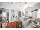 Spacious living room with hardwood floors, vaulted ceiling and open layout to the kitchen at 2235 Burlington N Ave, St Petersburg, FL 33713