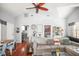 Open-concept living room with hardwood floors, adjacent to the kitchen and bedroom at 2235 Burlington N Ave, St Petersburg, FL 33713