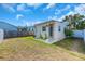Backyard featuring a well-maintained lawn and an outdoor structure with white brick steps at 2511 18Th N Ave, St Petersburg, FL 33713