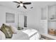Bright bedroom with a ceiling fan, a wardrobe, and soft, neutral-colored furnishings and decor at 2511 18Th N Ave, St Petersburg, FL 33713