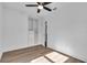 Bedroom featuring light laminate flooring, a wardrobe, and a ceiling fan at 2511 18Th N Ave, St Petersburg, FL 33713