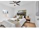 Bedroom featuring white walls, wood floors, ceiling fan, and windows for great natural light at 2511 18Th N Ave, St Petersburg, FL 33713