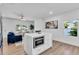 Modern kitchen features stainless steel appliances, a large island with seating, and stylish pendant lighting at 2511 18Th N Ave, St Petersburg, FL 33713
