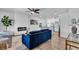 Open-concept living room with fireplace, hardwood floors, neutral walls, and modern furnishings at 2511 18Th N Ave, St Petersburg, FL 33713