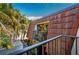 Balcony showing view of the outdoor space and tile roof in a lush tropical setting at 2627 2Nd Ct, Palm Harbor, FL 34684