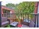 Balcony view with outdoor furniture, overlooking a tropical landscape with a patio at 2627 2Nd Ct, Palm Harbor, FL 34684