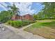 Charming townhome features a unique roof design and a well-maintained, landscaped yard at 2627 2Nd Ct, Palm Harbor, FL 34684
