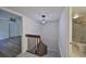 Upstairs hallway leading to bathroom, bedroom and staircase to the main living area at 2627 2Nd Ct, Palm Harbor, FL 34684