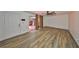 Spacious living room features wood floors, neutral walls, and access to the outdoor patio at 2627 2Nd Ct, Palm Harbor, FL 34684