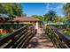 Walkway to Community Pool Area. Pool provides residents a fun way to cool off and connect with neighbors at 2627 2Nd Ct, Palm Harbor, FL 34684