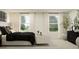 Serene bedroom with ample natural light, cozy bedding, and a relaxing atmosphere at 2668 Buttercup Lucine Ln, Ruskin, FL 33570