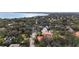 High angle aerial view of mature neighborhood with pool and partial water view at 2701 W Bay Ave, Tampa, FL 33611