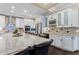 Open kitchen features stainless steel appliances, granite countertops, and a large center island with seating and a wine rack at 2701 W Bay Ave, Tampa, FL 33611