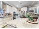 Kitchen boasts stainless appliances, granite countertops, white cabinetry, and a spacious island with barstool seating at 2701 W Bay Ave, Tampa, FL 33611