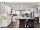 Bright, open kitchen features granite countertops, stainless steel appliances, and a large island with seating for entertaining guests at 2701 W Bay Ave, Tampa, FL 33611