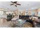 Bright and spacious living room that flows into the kitchen with a ceiling fan at 2701 W Bay Ave, Tampa, FL 33611