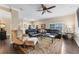 Spacious living room with dark wood floors, a ceiling fan, and plenty of seating at 2701 W Bay Ave, Tampa, FL 33611