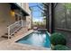 Inviting screened in pool and spa area featuring a peaceful outdoor space and lush landscaping at 2701 W Bay Ave, Tampa, FL 33611