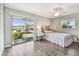 Bedroom with sliding doors to the outdoors for beautiful views and great natural light at 302 Andover S Pl # 162, Sun City Center, FL 33573