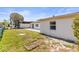 The backyard has a small, fenced-in garden bed with partial fence at 3544 Edenwood Dr, Holiday, FL 34691