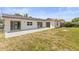 Backyard with an expansive patio for outdoor entertainment at 3544 Edenwood Dr, Holiday, FL 34691
