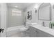 Clean bathroom with a tub and shower, vanity, and modern fixtures at 3544 Edenwood Dr, Holiday, FL 34691