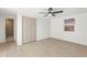 Well-lit bedroom with a closet, ceiling fan and window at 3544 Edenwood Dr, Holiday, FL 34691