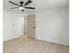 Bright bedroom features a ceiling fan and wood-look flooring at 3544 Edenwood Dr, Holiday, FL 34691