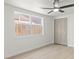 Empty bedroom with closet, large window and natural light at 3544 Edenwood Dr, Holiday, FL 34691