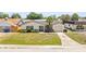 Single-story home featuring an attached garage, well-manicured lawn, and inviting front entrance from the street at 3544 Edenwood Dr, Holiday, FL 34691