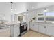 Updated kitchen with light wood floors and stainless steel appliances at 3544 Edenwood Dr, Holiday, FL 34691