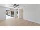 Open living room with sliding glass doors to backyard and closet at 3544 Edenwood Dr, Holiday, FL 34691