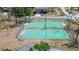 Aerial view of community basketball courts with a residence in the background at 3728 Parkway Blvd, Land O Lakes, FL 34639
