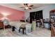 Bedroom with pink accent wall and ceiling fan at 3728 Parkway Blvd, Land O Lakes, FL 34639