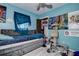 A blue bedroom with an open closet and decor at 3728 Parkway Blvd, Land O Lakes, FL 34639