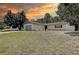 Inviting single-Gathering home featuring a spacious front yard and a convenient attached two-car garage at 3728 Parkway Blvd, Land O Lakes, FL 34639